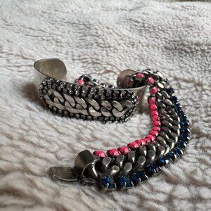 A Dannijo cuff and a Dannijo chain bracelet.